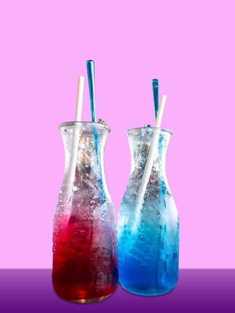 Red and blue Italian soda carbonated water and flavored syrupの写真素材