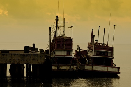 fishing boats in the yellow sky