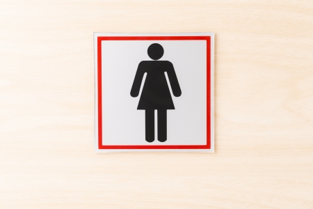 woman toilet sign on the wood wallの写真素材