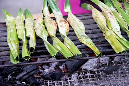 Sweet dessert packing with palm leafs.の写真素材