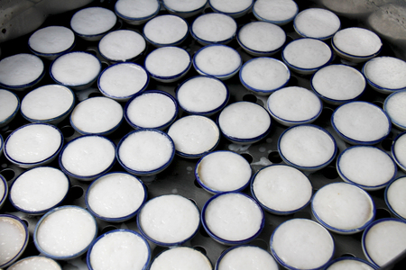 Coconut milk custard in small porcelain cupの写真素材