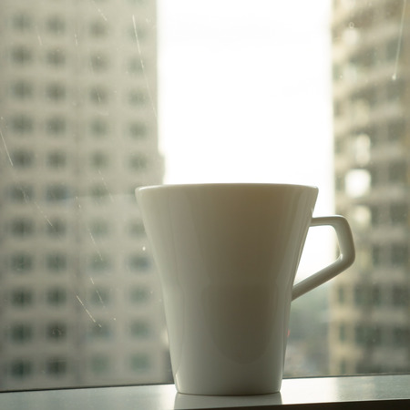 a cup of coffe with city viewの写真素材