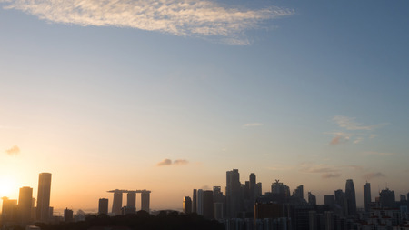 Silhouette Cityscape of Singapore at sunrise.の写真素材