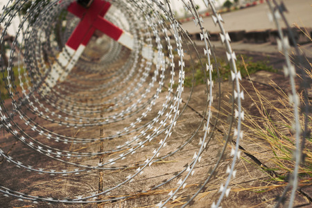 Metal fence with razorsの写真素材