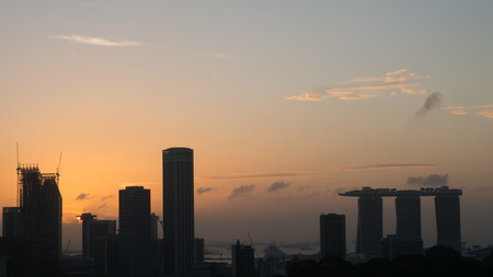 Silhouette Cityscape of Singapore at sunriseの写真素材