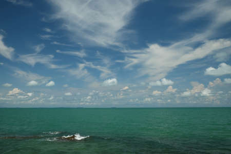 Beautiful seascape. Blue sea and sky with clouds.