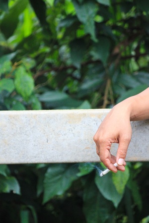 The man is smokingの写真素材