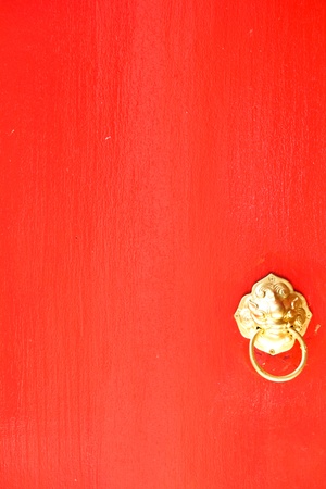 Burgundy colored door with knocker の写真素材