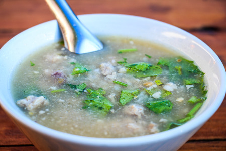 Thai boiled rice with pork and mushroom for breakfastの写真素材