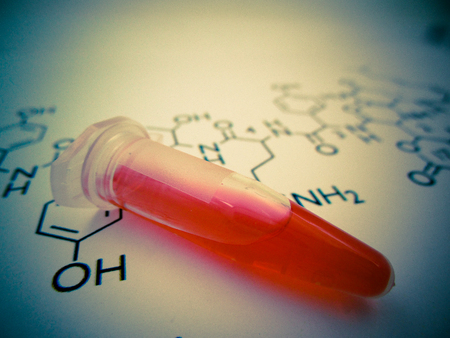 Test tube with chemical formula in laboratoryの写真素材