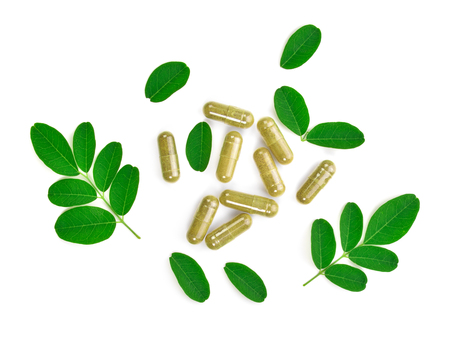Moringa leaves isolated on whiteの写真素材