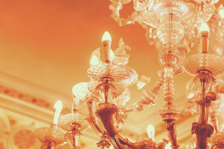 Part of the beautiful luminous crystal chandelier, close-upの写真素材