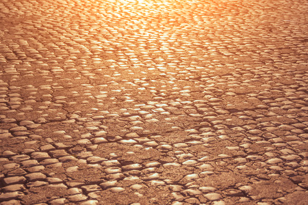 Cobblestone Road at sunset, background, textureの写真素材