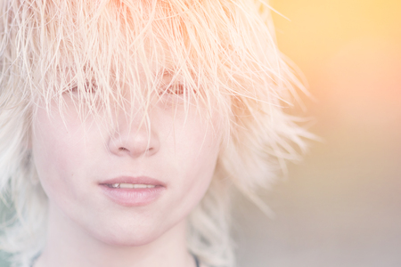 Portrait of a teenage girl with short blond hair. Tonedの写真素材