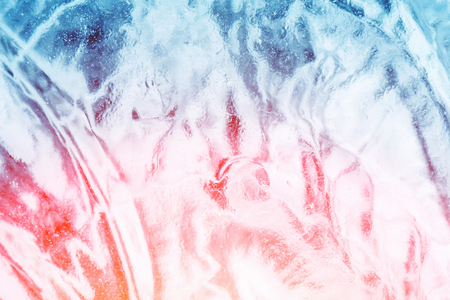 Ice background with an abstract pattern in the sunlightの写真素材
