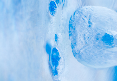 Blue ice with bubbles, background