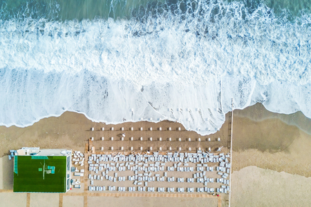 Top view of the sea and the beach with sun bedsの写真素材