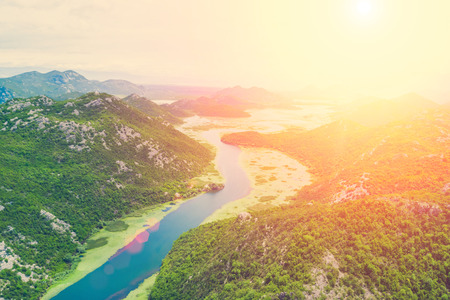Top view of a river  in the mountains on a sunny day on a sunny dayの写真素材