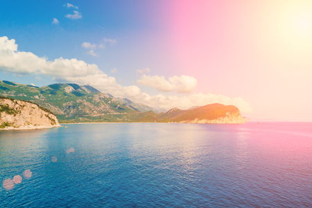 Mountains and the sea in the sunlightの写真素材