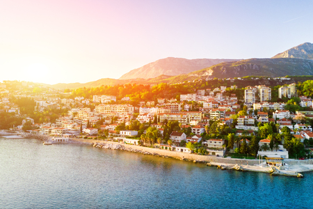 Top view of town in the mountains by the sea on the sunsetの写真素材