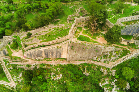 Old ruined stone wall in the mountains, top viewの写真素材