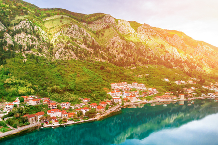 Panoramic view of the Old European city at the foot of the mountains near the sea in the sunshineの写真素材