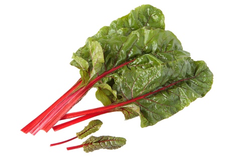 Red chard leaves in water drops on white background