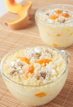 Two cups of rice pudding with pumpkinの写真素材
