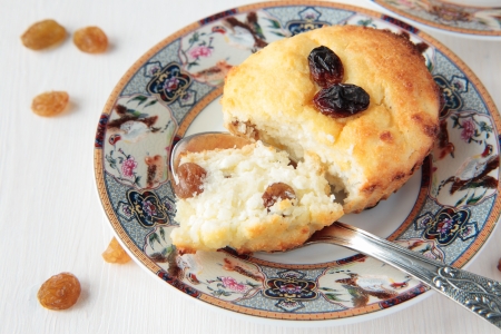 Two cottage cheese gratin with raisins on plateの写真素材