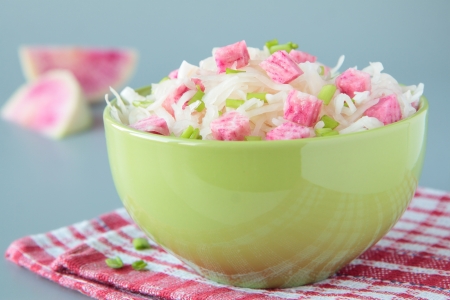 Salad of sauerkraut and pink radish in bowlの写真素材