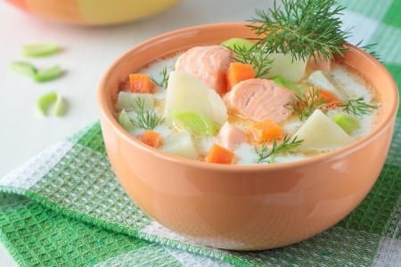 Salmon soup with cream, potatoes, carrots, dillの写真素材