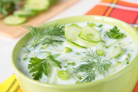 Cold soup made ââfrom yogurt and cucumbers with dill and parsleyの写真素材