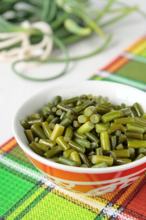 The stems of garlic fried in oilの写真素材