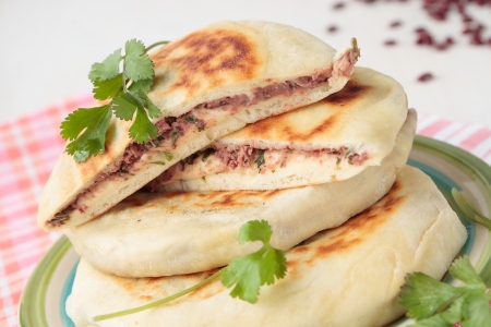 Stack of flat bread with red beans and corianderの写真素材