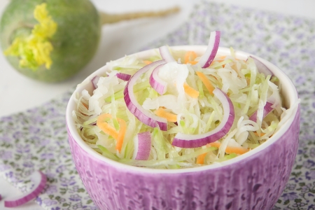 Green radish salad with sauerkraut and onionsの写真素材