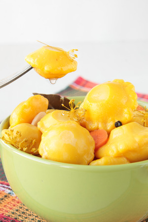 Bowl with marinated squash on a checkered napkinの写真素材