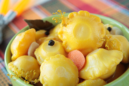 Bowl with marinated squash on a checkered napkin の写真素材