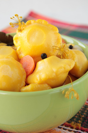 Bowl with marinated squash on a checkered napkinの写真素材
