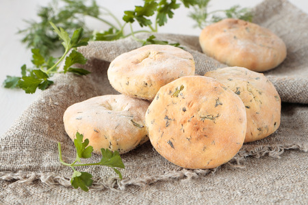 Flat bread of wheat flour with dill, parsley and cilantroの写真素材