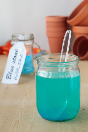 Solution of copper sulphate in a glass jarの写真素材