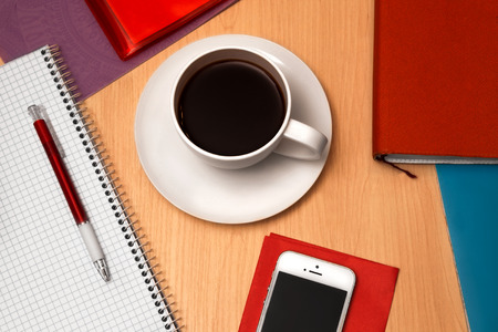 Office desk table with documents and  coffe cupの写真素材