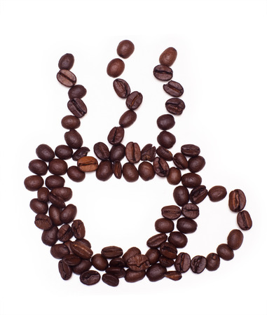Closeup of Cup made of cofee beans on white backgroundの写真素材