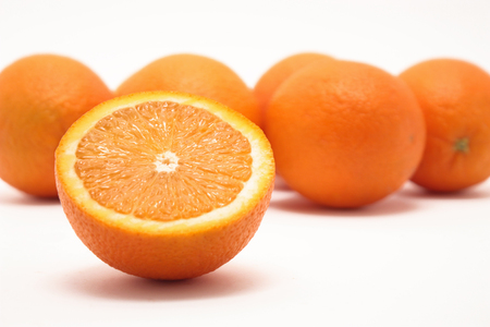 Close-up Photo of fresh Oranges on white backgroundの写真素材