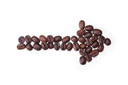Photo of Arrow made of Coffee Beans on white backgroundの写真素材