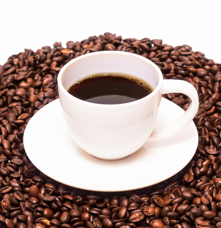 Closeup photo of cup of coffee on white tableの写真素材