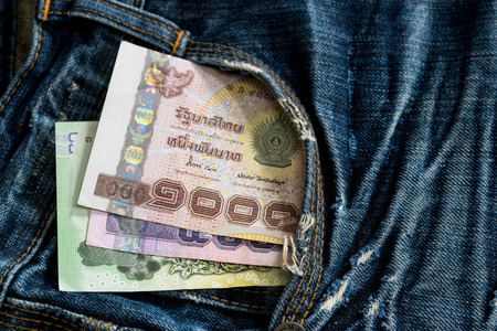 Thai money in Blue jeans pocket.