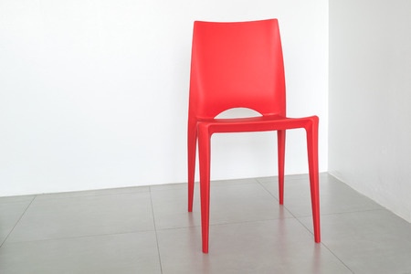 The red chair on the white room.の写真素材
