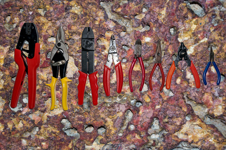 Hand tools set on Colorful vintage stone wall texture background.の写真素材