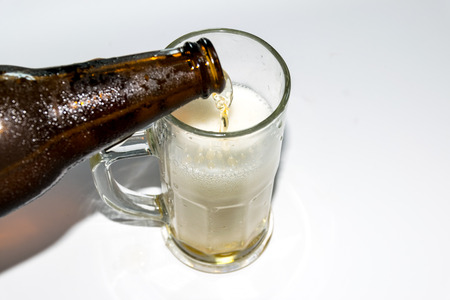 Beer golden white bubbles in the glass.の写真素材