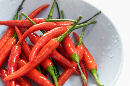 Fresh red peppers isolated on white background.の写真素材